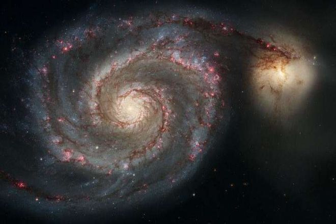 A imagem, registrada pelo telescópio Hubble, mostra o início da colisão entre as galáxias M51a e M51b, que são similares à Via Láctea e à Grande Nuvem de Magalhães (Foto: NASA, ESA, S. Beckwith, The Hubble Heritage Team)