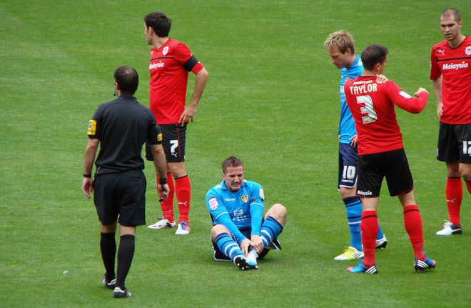 Jogador com lesão no tornozelo