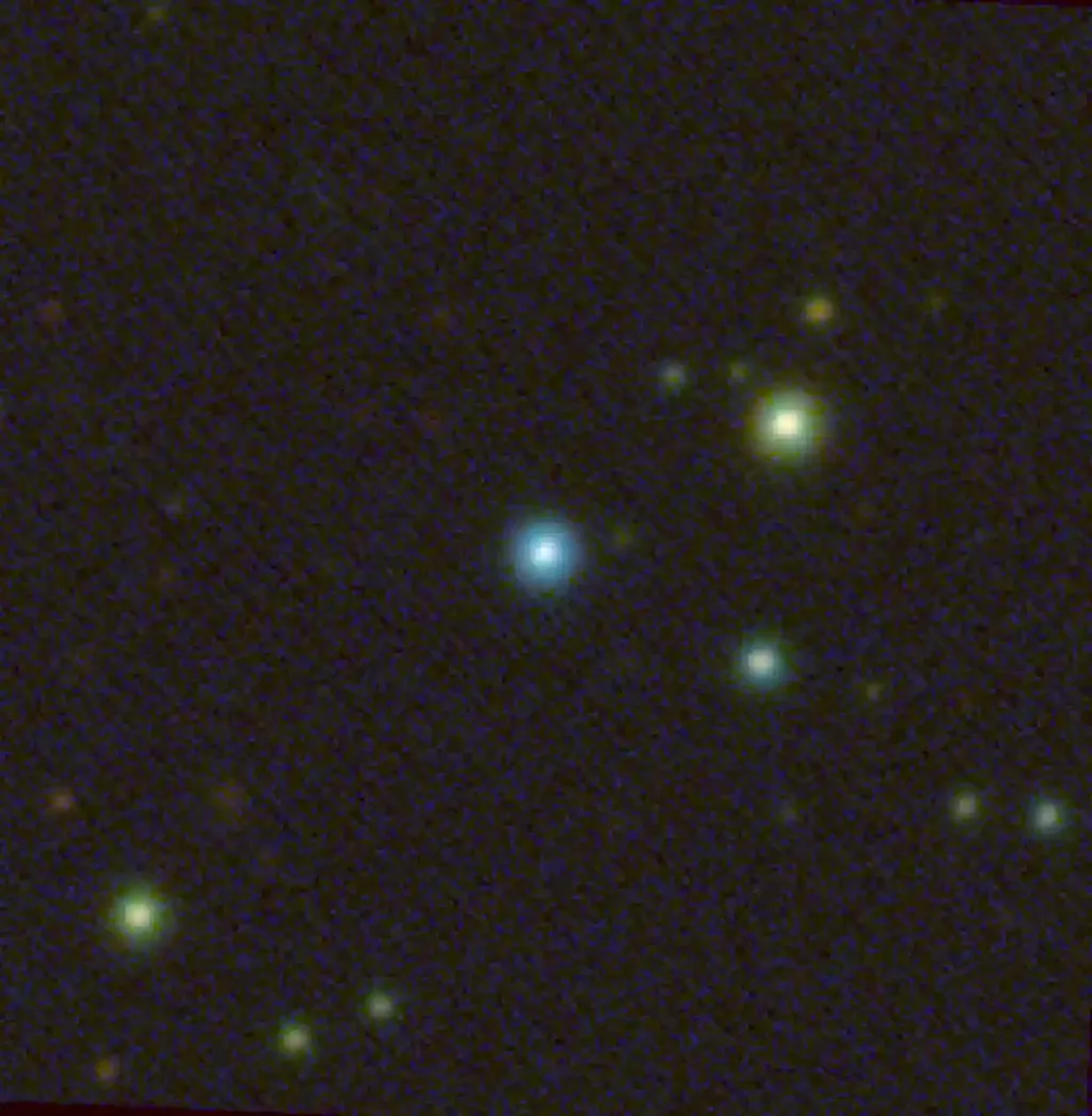 O buraco negro J1144 aparece como um ponto azul na foto (Imagem: Reprodução/Christopher Onken/Australian National University)