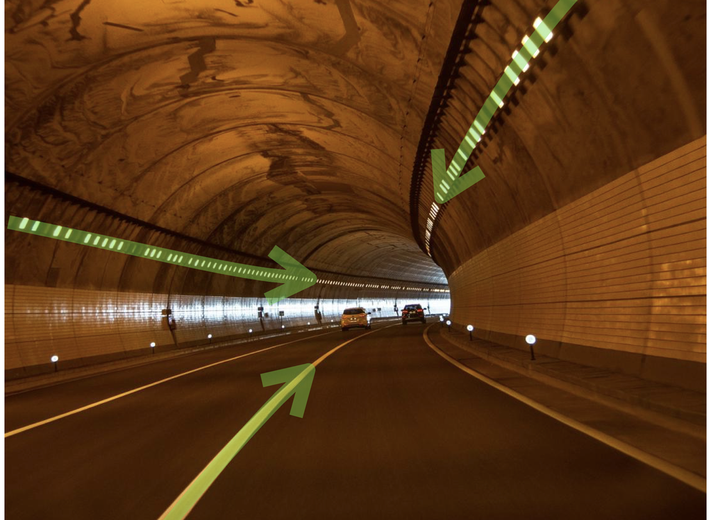 Um túnel curvo, com linhas formadas pelas luzes do túnel e faixas, ilustra como essas linhas parecem convergir na distância, semelhante ao túnel formado pelas estruturas acima e abaixo do Sistema Solar (Imagem: Reprodução/Pixabay/wal_172619/J. West)