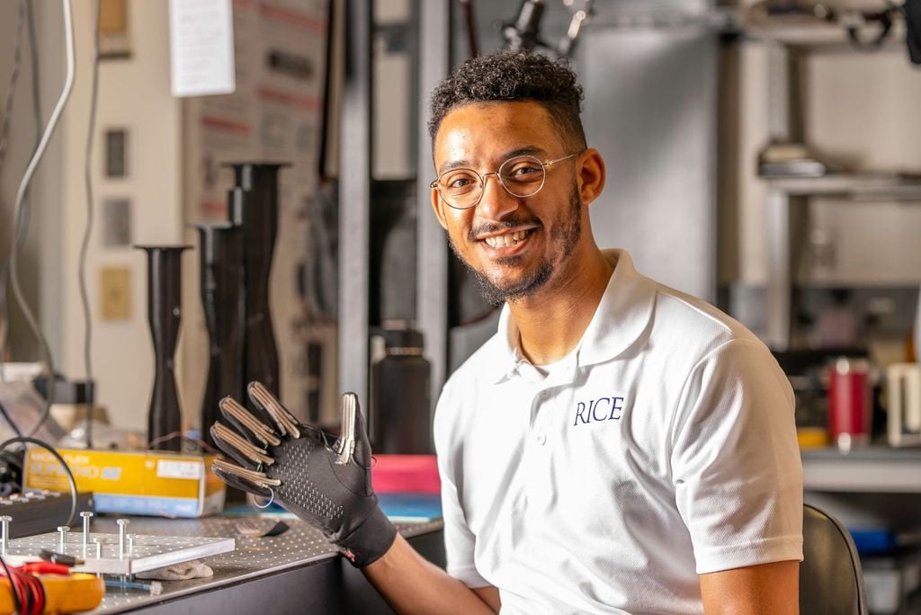 Marquis Bell, a mechanical engineering student at Rice University and lead author of the study, uses a glove with the Smart Disinfectant (Photo: Gustavo Raskoski/Rice University)