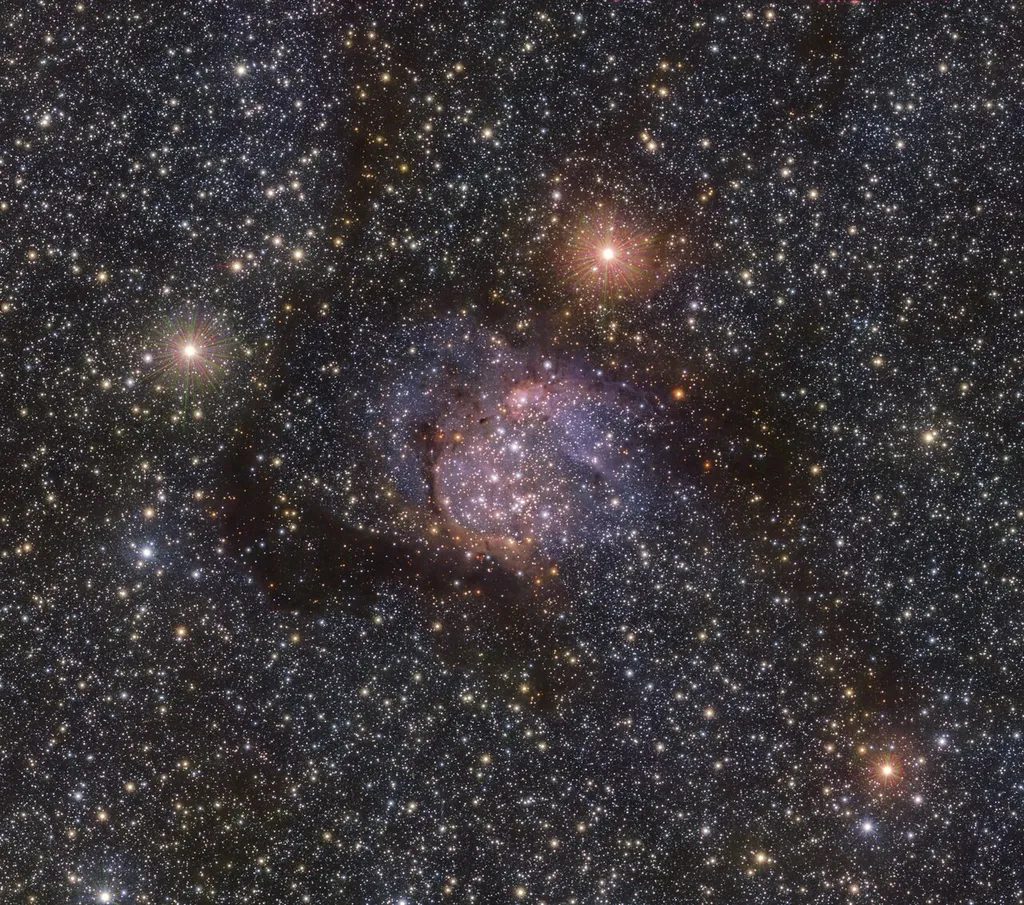 A Sh2-54 vista na luz infravermelha revela as estrelas por trás das nuvens de poeira (Imagem: Reprodução/ESO/VVVX)