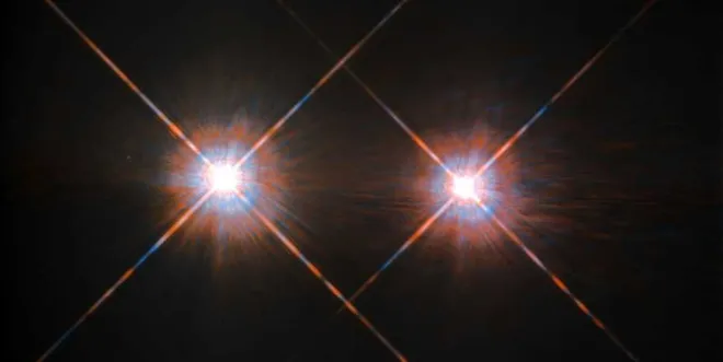 À esquerda, a estrela Alpha Centauri A, e à direita, Alpha Centauri B (Imagem: Reprodução/ESA/Hubble & NASA)