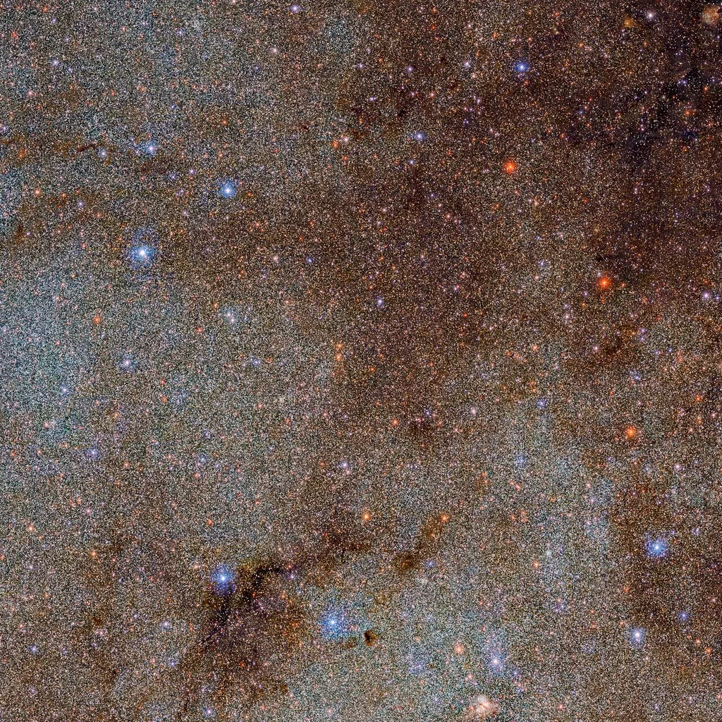 Uma pequena parte do catálogo, repleta de estrelas e nuvens de poeira escura (Imagem: Reprodução/DECaPS2/DOE/FNAL/DECam/CTIO/NOIRLab/NSF/AURA)