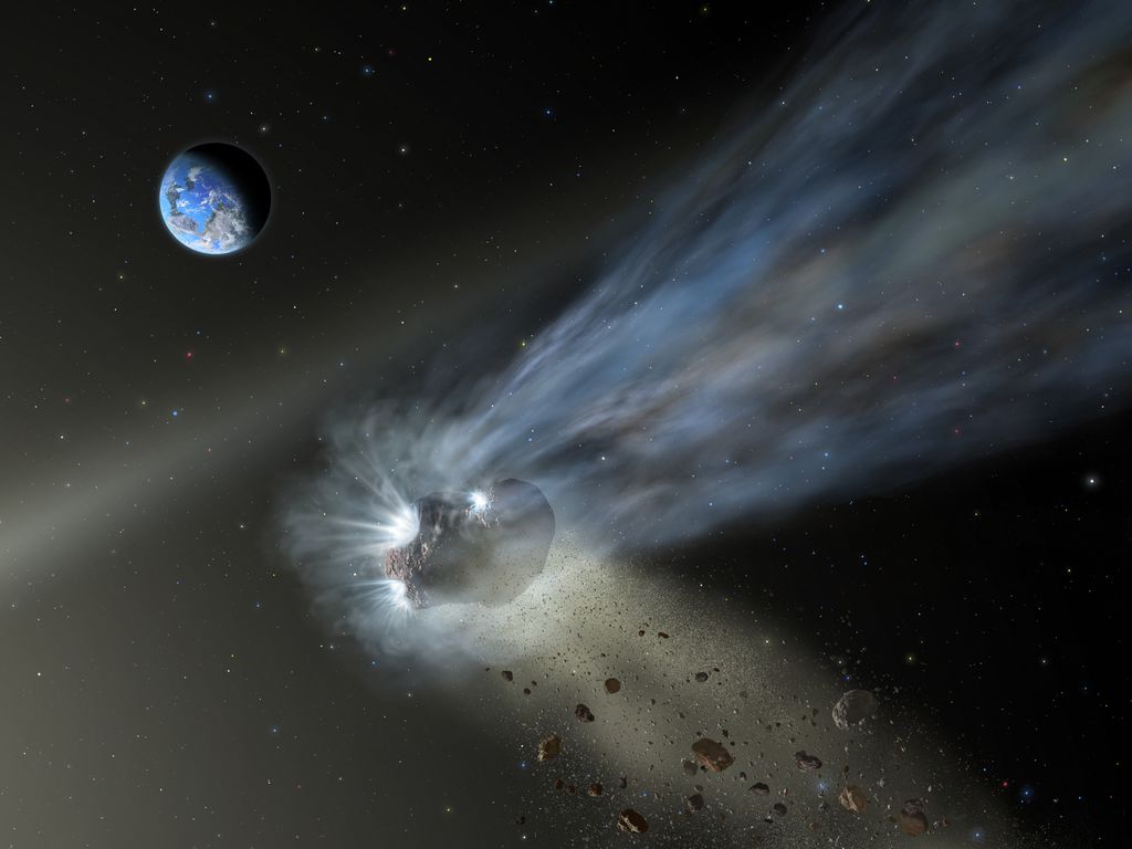 Concepção artística de cometa liberado gases, poeira e pedaços de seu núcleo a medida que se aproxima do Sol (Imagem: Reprodução/NASA)