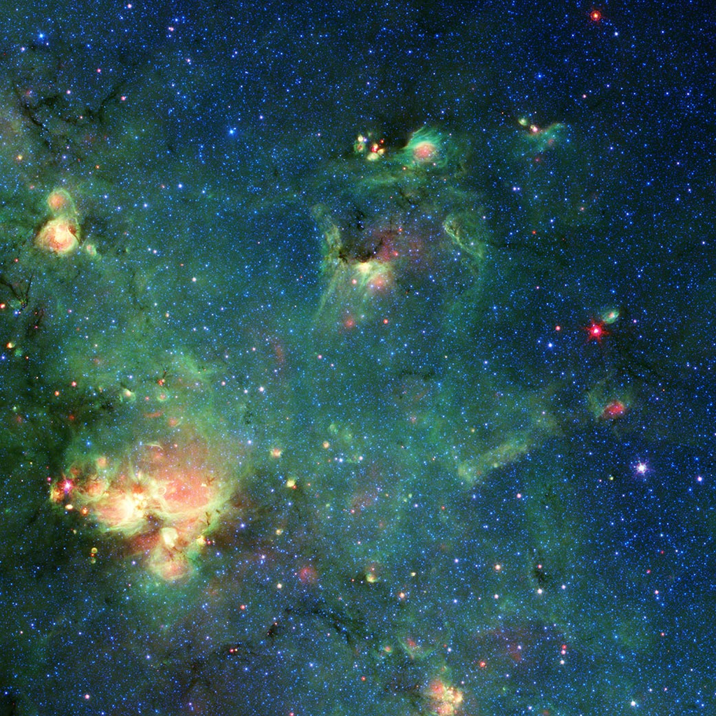 Os gases e poeira da nebulosa, registrados pelo Spitzer... (Imagem: Reprodução/NASA/JPL-Caltech)