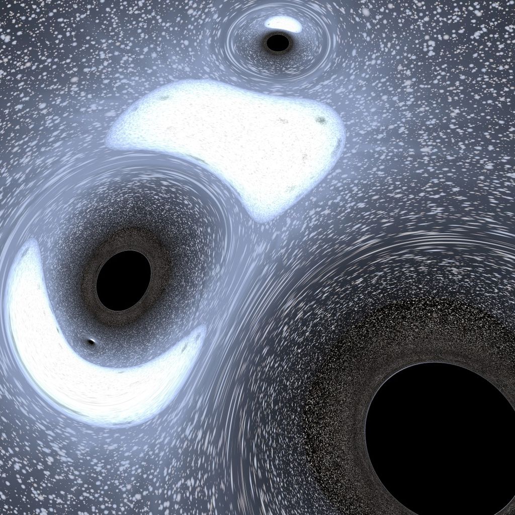 Esta simulação de computador mostra vários buracos negros encontrados no coração de um denso aglomerado globular de estrelas (Imagem: Reprodução/Aaron M. Geller, Northwestern University/CIERA)