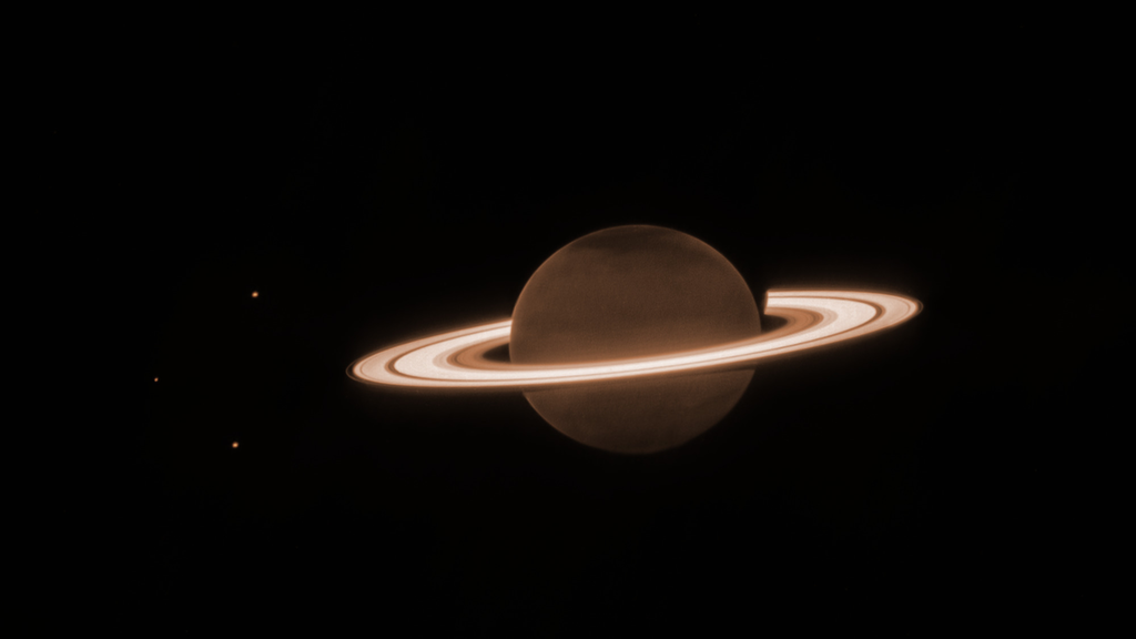 Foto do Telescópio Espacial James Webb onde os anéis de Saturo brilham na escuridão do universo (Imagem: NASA/ESA/CSA/STScI/AURA)