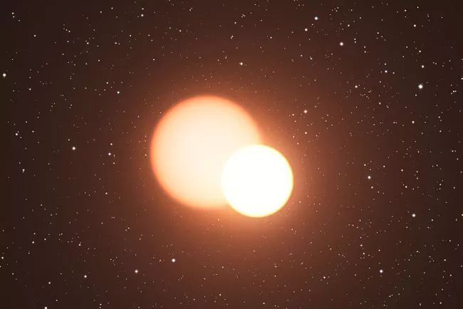 Representação de sisema estelar binário eclipsante, como é o caso de VV Cephei; apesar de ter duas estrelas, é comum que elas pareçam ser uma só no céu noturno (Imagem: Reprodução/ESO/L. Calçada)
